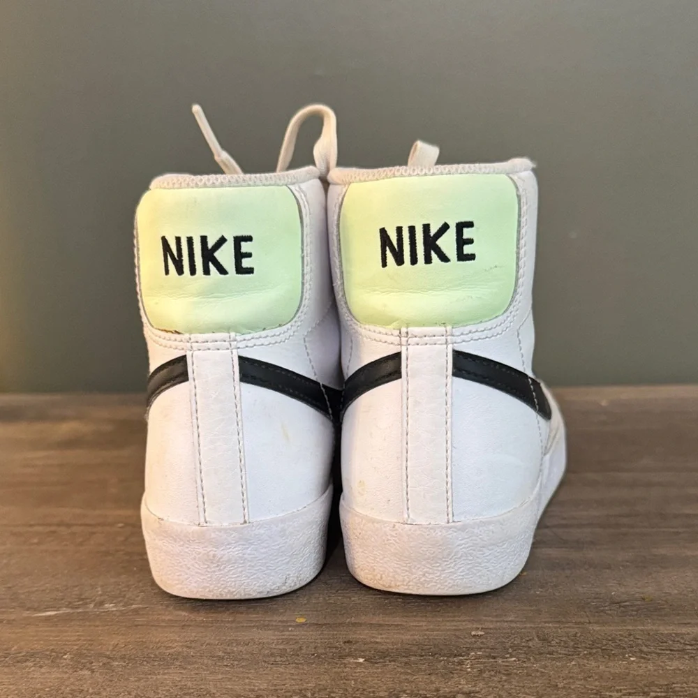 Nike White High-Top Sneakers with Black Swoosh